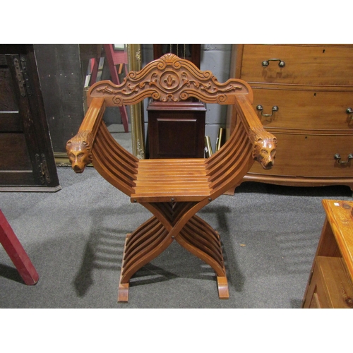 1056 - An Asian folding chair with lion mask arm rests