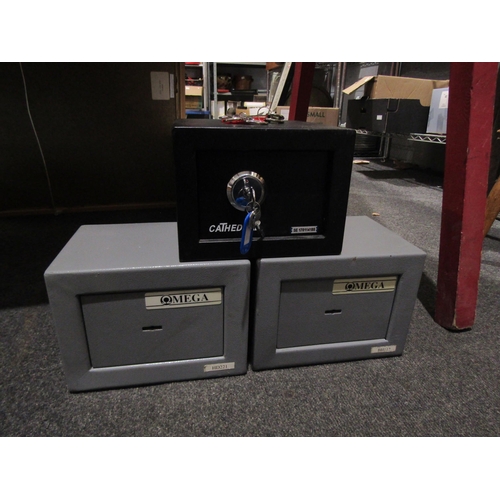 1061 - Two Omega metal safes and a Cathedral example, table-top size, with keys (3)