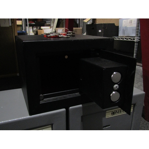 1061 - Two Omega metal safes and a Cathedral example, table-top size, with keys (3)