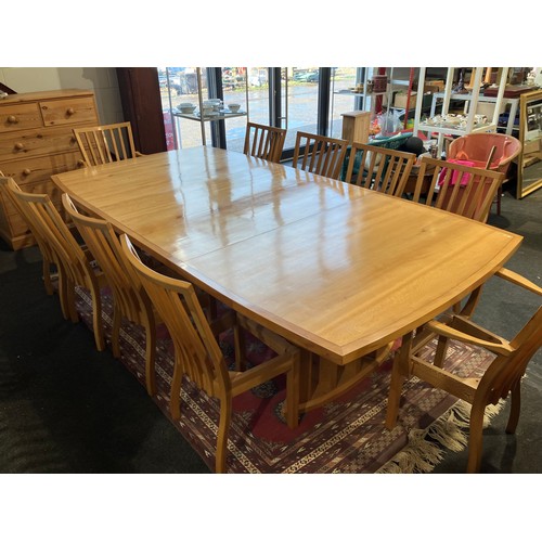 1020 - An extending dining table and ten chair frames (8+2 carvers) in London Plane timber by Cy Woodrow, N... 