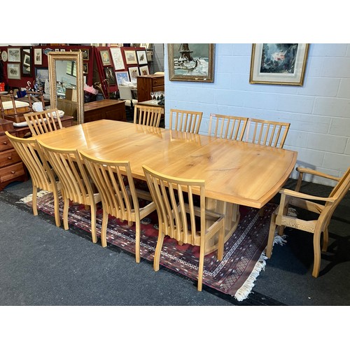 1020 - An extending dining table and ten chair frames (8+2 carvers) in London Plane timber by Cy Woodrow, N... 