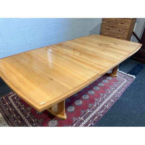 1020 - An extending dining table and ten chair frames (8+2 carvers) in London Plane timber by Cy Woodrow, N... 