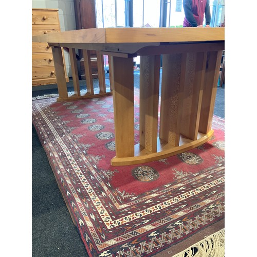 1020 - An extending dining table and ten chair frames (8+2 carvers) in London Plane timber by Cy Woodrow, N... 