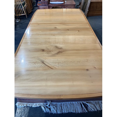 1020 - An extending dining table and ten chair frames (8+2 carvers) in London Plane timber by Cy Woodrow, N... 