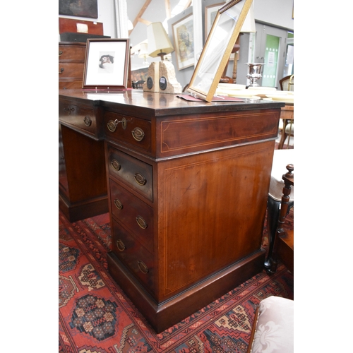 4033 - An Edwardian line inlaid mahogany breakfront twin pedestal desk, with three frieze drawers (each wit... 