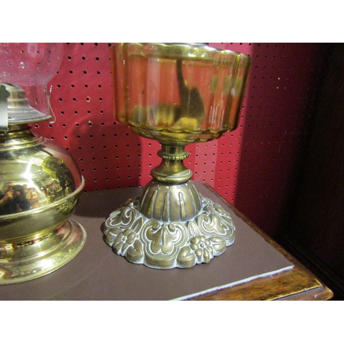 4039 - A Victorian brass based oil lamp with another later example (2)