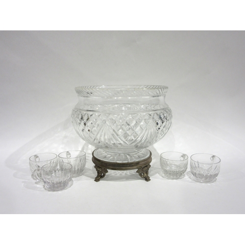 4046 - A cut crystal glass table centrepiece/punch bowl raised on footed base, 21cm diameter, together with... 