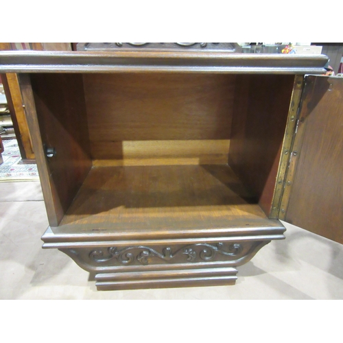 4051 - A small single door cupboard with carved upstand, 56cm total hight with gallery back