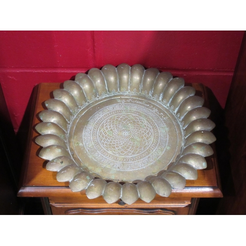 4016 - An Eastern brass bowl with fluted edge, 36cm diameter