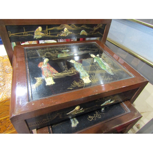 4013 - A chinoiserie nest of four tables. Figural scenes in relief under glass top to each along with scene... 