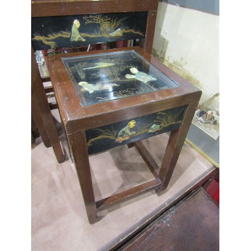 4013 - A chinoiserie nest of four tables. Figural scenes in relief under glass top to each along with scene... 