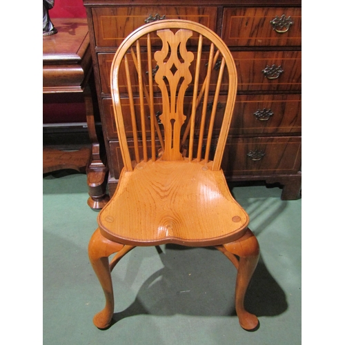 2048 - A pair of hoop back Windsor chairs with cabriole fore legs united by a crinoline stretcher