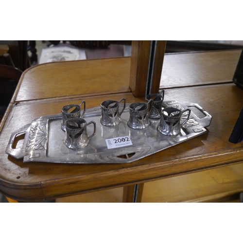 2002 - An Art Nouveau silver plated tray and six cups no glass liners