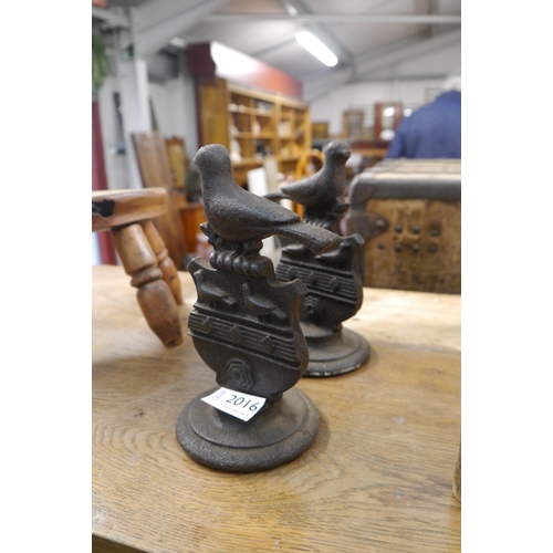 2016 - Pair of 19th Century cast iron bookends modelled as a bird atop a shield with a rose