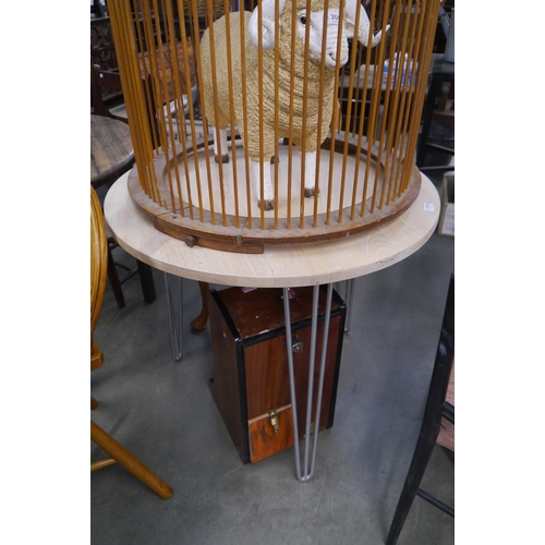 2049 - An ash circular table on hairpin legs