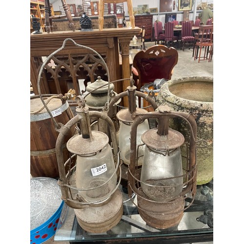 2042 - Four tilley lamps