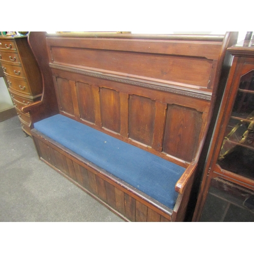 An 1940's oak high-back settle, drop-in seat