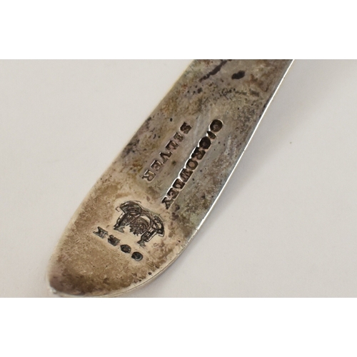 6034 - An Irish Provincial silver sifting spoon by O'Crowley, the bowl decorated with Harp, hound and folia... 