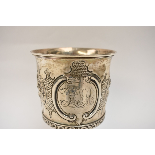 6006 - A Georgian silver wine goblet with embossed floral cartouches, decorative border, central monogramme... 