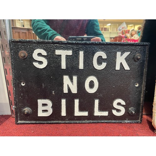 7045 - A cast iron sign - Stick No Bills, with what looks like original corner fixings, cut on reverse, 37c... 