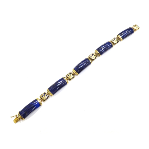 7505 - A 14ct gold bracelet with five curved panels of Lapis Lazuli, 19.5cm long, 15.7g