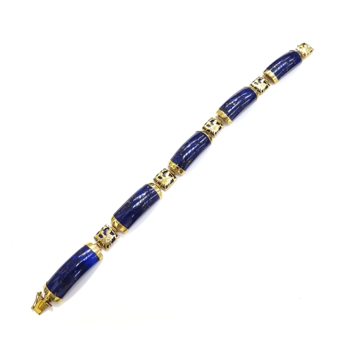 7505 - A 14ct gold bracelet with five curved panels of Lapis Lazuli, 19.5cm long, 15.7g