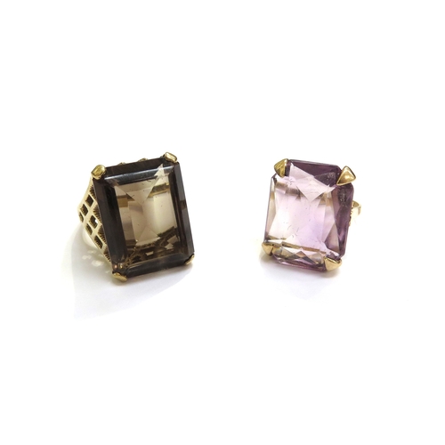 7432 - A 9ct gold ring set with a large rectangular smoky quartz, size N and another with amethyst coloured... 