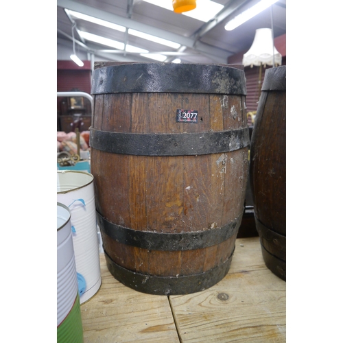 2060 - An oak half barrel stick stand