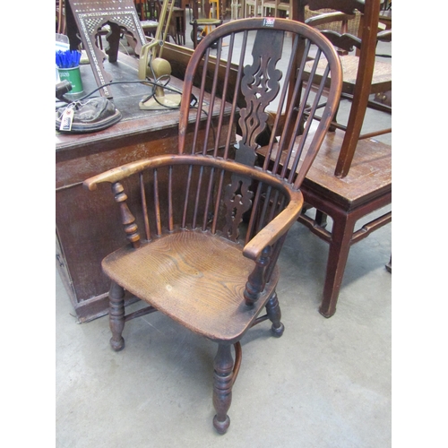 2001 - A Georgian yew and elm seated Windsor chair with crinoline stretcher