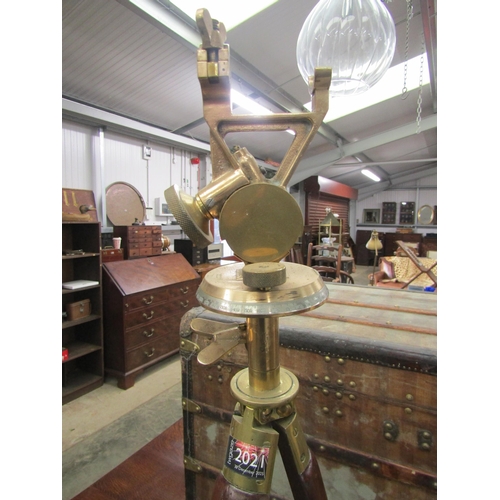 2021 - A mahogany and brass scope stand with bronze attachment