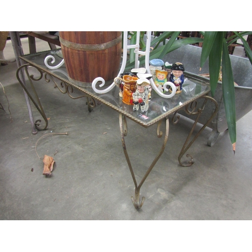 2048 - A wrought iron glass top coffee table