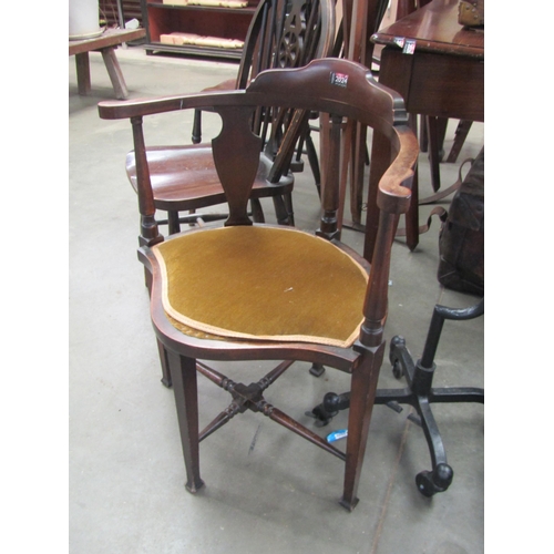 2024 - An Edwardian mahogany corner chair