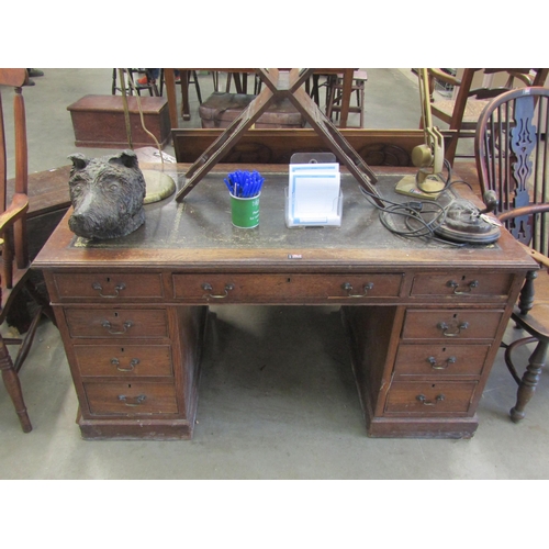 2001 - An Edwardian oak leatherette topped pedestal desk for restoration, 136cm x 73cm x 70cm (h)