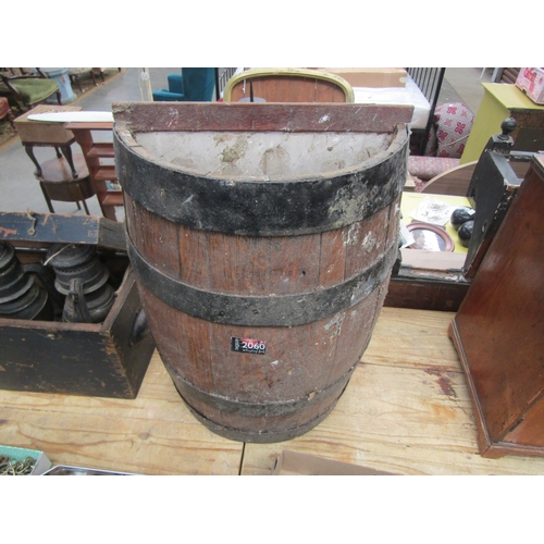 2043 - An oak half barrel stick stand