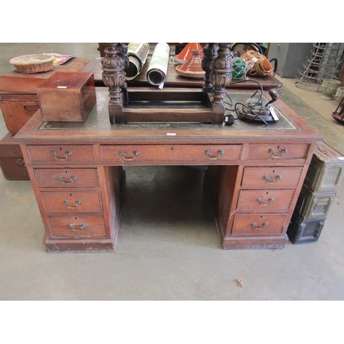 2001 - An Edwardian oak leatherette topped pedestal desk for restoration, 136cm x 73cm x 70cm (h)