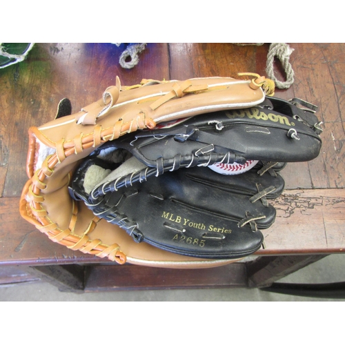 2007 - Two leather baseball gloves and one ball