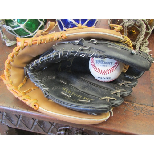 2007 - Two leather baseball gloves and one ball