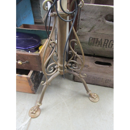 2030 - A brass standard lamp with paw feet