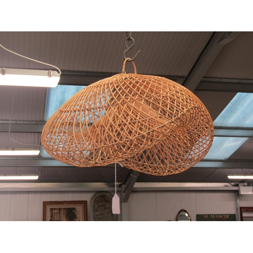 2031 - A rattan lampshade hanging