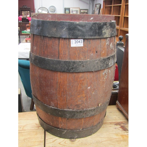 2043 - An oak half barrel stick stand