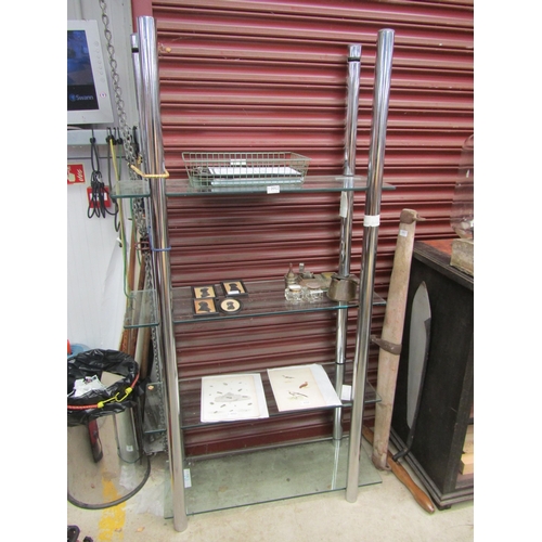 2052 - A chrome and glass, four tier shelving unit a/f