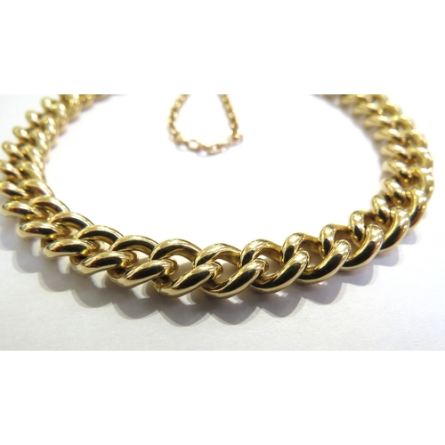 7020 - An 18ct gold curb link bracelet, each link stamped, 20cm long, 40g