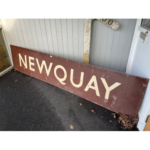 7010 - A brown enamel BR (W) 'Newquay' railway platform sign, 290cm x 61cm