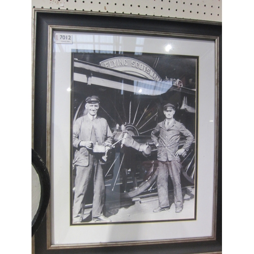 7012 - A reproduction cast 'Flying Scotsman' name plate and framed and glazed black and white photograph of... 
