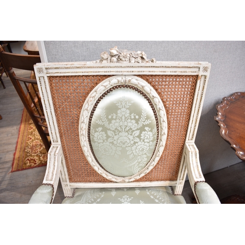 4070 - An 18th Century style French fauteuil white-painted open armchair with damask upholstery and cane ba... 