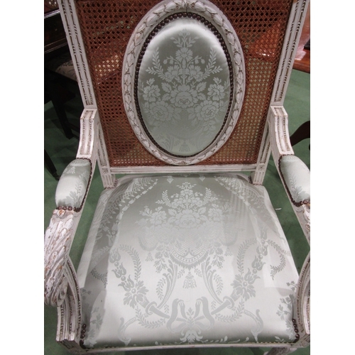 4070 - An 18th Century style French fauteuil white-painted open armchair with damask upholstery and cane ba... 