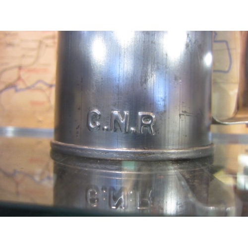 7112 - A Canadian Railways upright oil can, stamped CNR to the side, 62cm tall