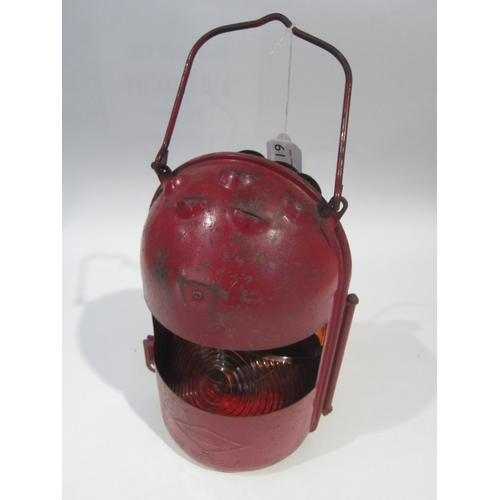 7119 - A red painted Nicoln Blitz rail lamp marked Belgium to the side with interior burner and reservoir.