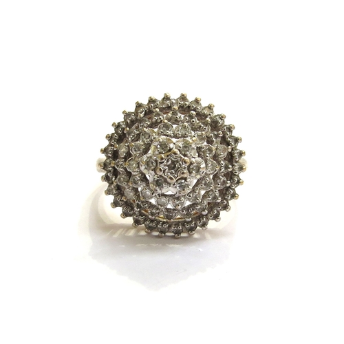 7297 - A 9ct gold diamond domed cluster cocktail ring. Size N, 4.4g