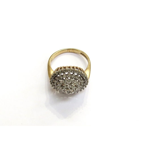 7297 - A 9ct gold diamond domed cluster cocktail ring. Size N, 4.4g